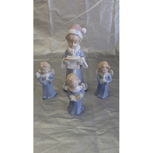 192 - A Collection of Nao Style Figurines x 9 inc . Angels, Religious Mother and Child, Girl with Clarinet... 