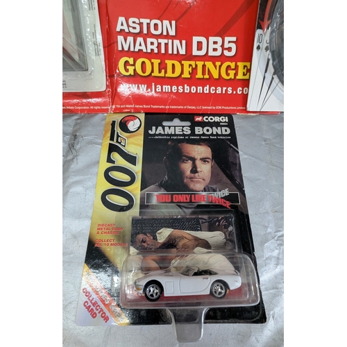 1838 - 2 James Bond Unopened Carded Cars And One Unopened Cased Car With Backing Board Including - Corgi Yo... 