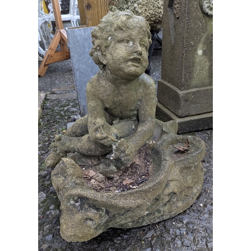 11B - A Garden Water Feature - A Cherub Ornament -( 50 x 40 x 55cm) and sunken porcelain base - 121cm Diam... 