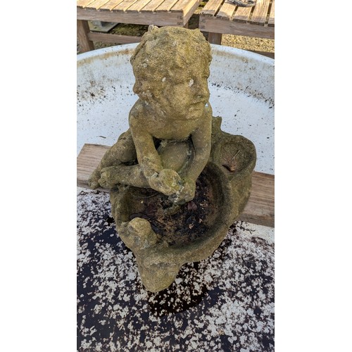 11B - A Garden Water Feature - A Cherub Ornament -( 50 x 40 x 55cm) and sunken porcelain base - 121cm Diam... 