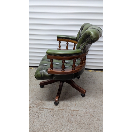 78 - WITHDRAWN Button Back Captains Chesterfield Swivel Chair , Antique Green Leather with Wooden Balustr... 