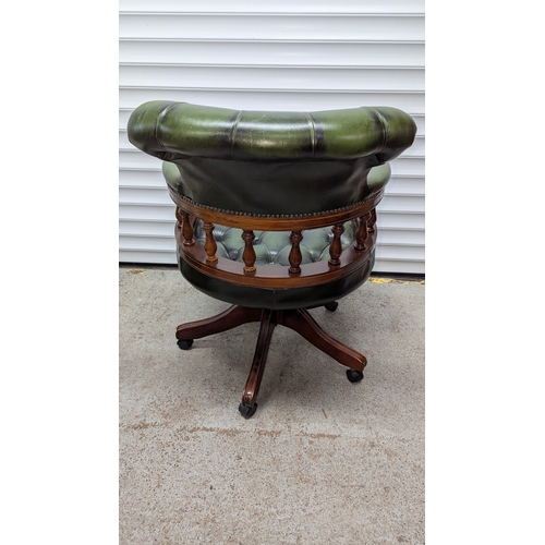 78 - WITHDRAWN Button Back Captains Chesterfield Swivel Chair , Antique Green Leather with Wooden Balustr... 