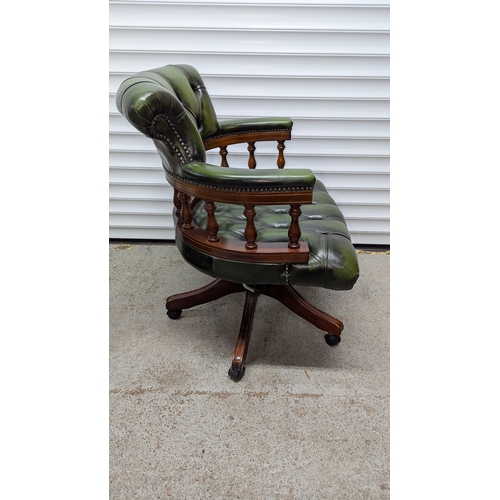 78 - WITHDRAWN Button Back Captains Chesterfield Swivel Chair , Antique Green Leather with Wooden Balustr... 