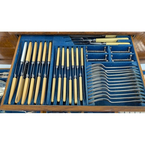 37 - An Oak and Brass Cased 4 Drawer Canteen of Cutlery 54 x 34 x 42cm