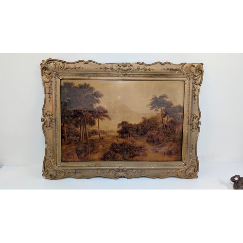 703 - A Large Gilt Framed Print Under Glass of an English Landscape 130cm x 98cm in Frame.