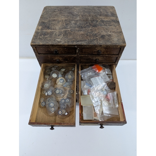 123 - Vintage Watchmaker’s Parts Cabinet w/ Contents

Early–mid 20th century wooden watchmaker’s cabinet w... 