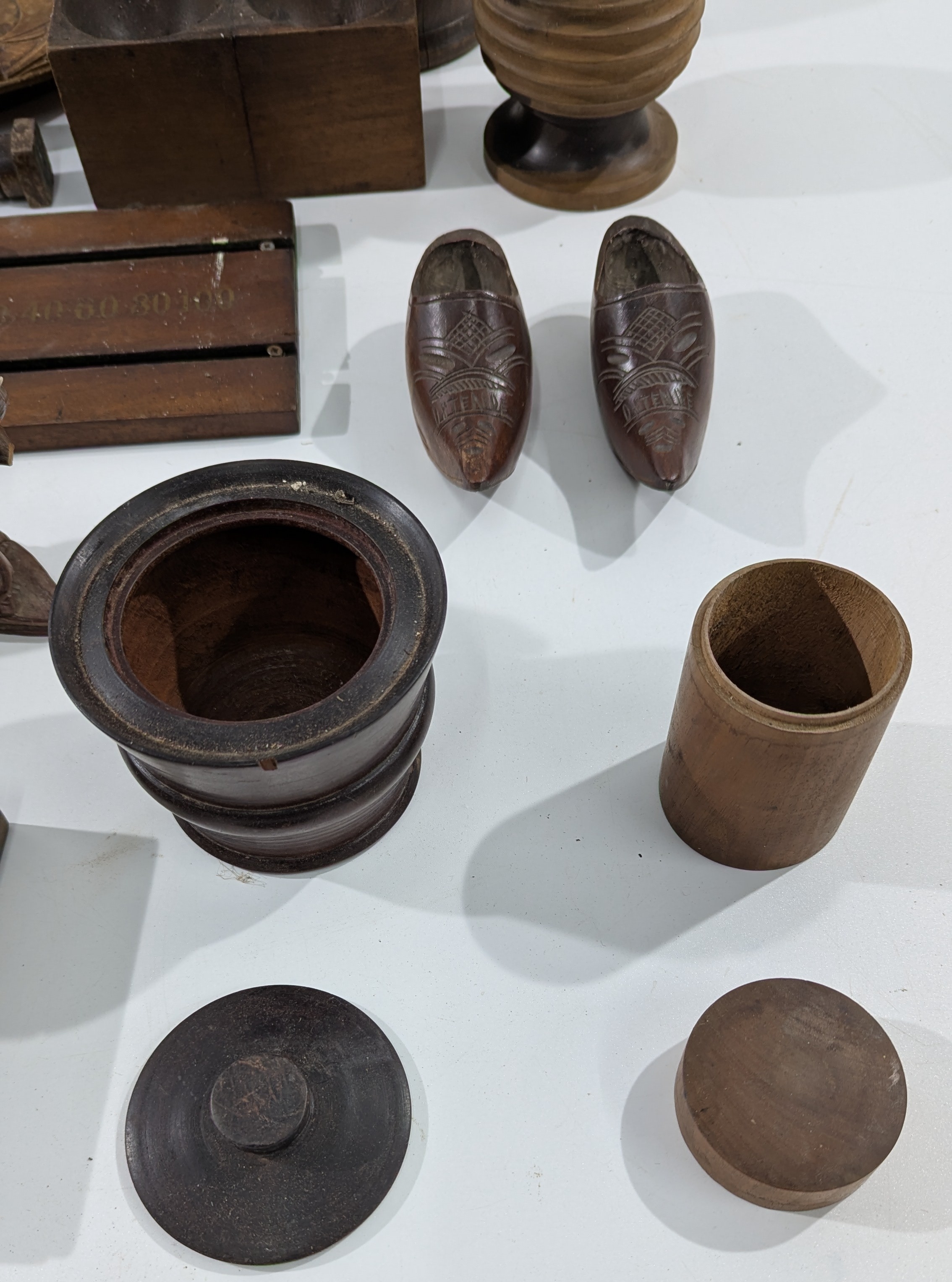 A varied group of antique wooden items, including treenware, decorative ...