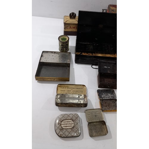 A collection of vintage and early 20th-century tins and boxes ...