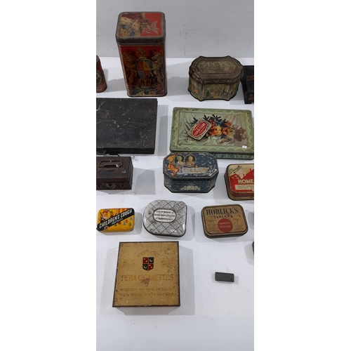 A collection of vintage and early 20th-century tins and boxes ...