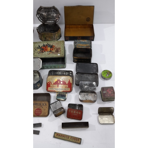 A collection of vintage and early 20th-century tins and boxes ...