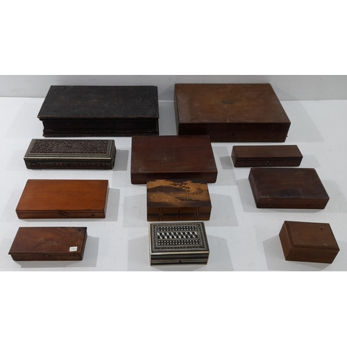 A collection of assorted antique and vintage wooden boxes and cases, in ...