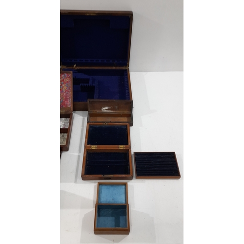 A collection of assorted antique and vintage wooden boxes and cases, in ...