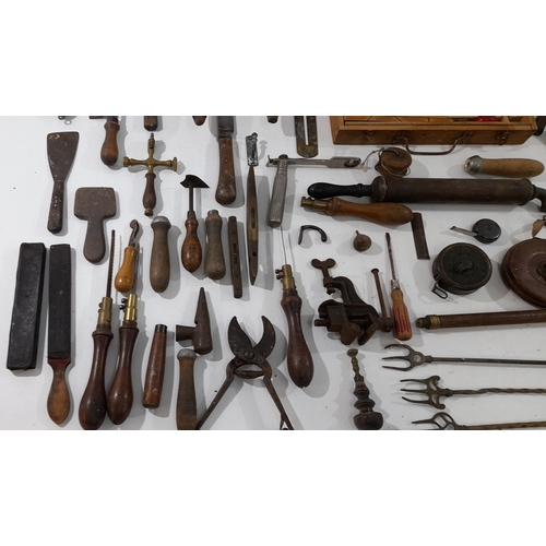 A mixed lot of antique hand tools and workshop implements, including a ...