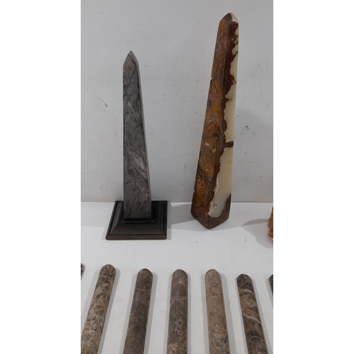 A group of decorative stone and mineral specimens, including two tall ...