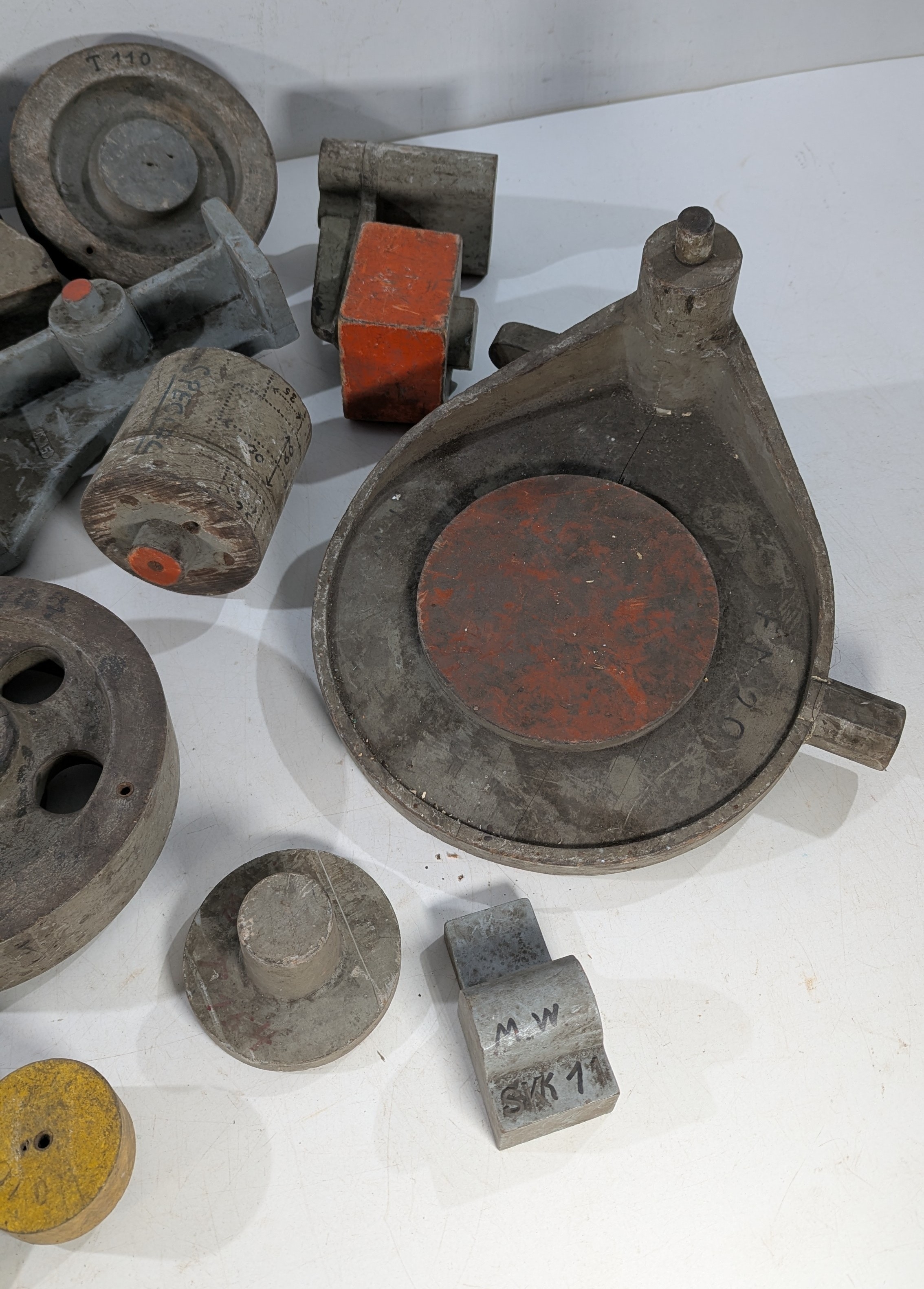 A mixed lot of industrial foundry patterns and tooling components ...