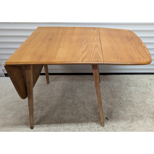 Ercol Light Elm Drop-Leaf Dining Table

A mid-century Ercol light elm drop-leaf dining table, the rectangular top with rounded corners and twin fall leaves, raised on four tapering legs. The underside retaining original metal support rails and mechanism.

Approximate size (extended): 140cm long x 76cm wide x 72cm high.


Condition: generally good overall with light surface wear, minor scuffs to legs and edges consistent with age and use. Mechanism operates as intended.