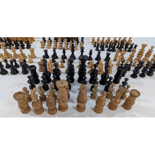 Collection of assorted wooden chess pieces, comprising multiple part ...