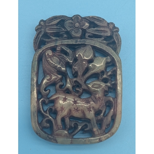 CHINESE PIERCED JADE &lsquo;FU LU&rsquo; PLAQUE WITH SPOTTED DEER AND BAT

A Chinese carved and pierced jade plaque of vertical rectangular form with a floral crest, decorated in openwork with a spotted deer beneath a bat amid scrolling foliage. The stone of jade-green tone with natural russet inclusions.

The deer and bat form the auspicious rebus &ldquo;Fu Lu&rdquo; (福禄) &mdash; blessings and prosperity &mdash; symbolising good fortune and official success in Chinese art.

Qing dynasty or later.

Approx. 5.5cm high.

Condition:
Natural inclusions and surface wear consistent with age and handling.