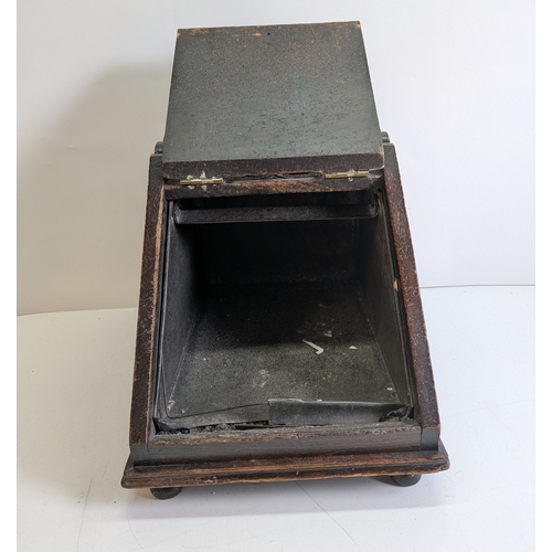 393 - Victorian Carved Coal Scuttle with Brass Mounts and Scoop

Victorian carved wooden coal scuttle of s... 