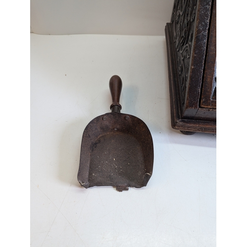 393 - Victorian Carved Coal Scuttle with Brass Mounts and Scoop

Victorian carved wooden coal scuttle of s... 