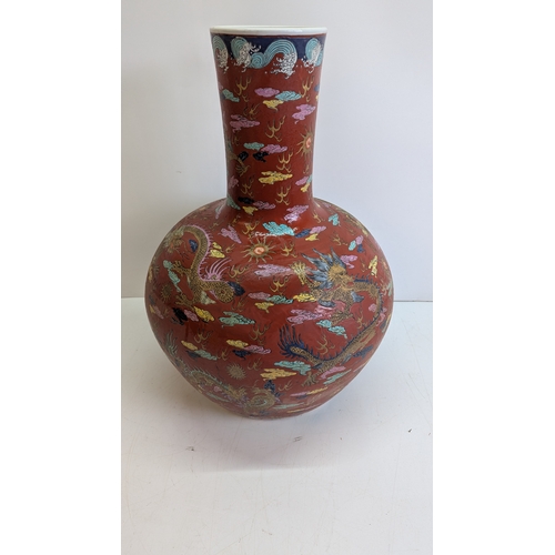 51 - Large Vintage Chinese-Style Polychrome Dragon Vase

A substantial decorative vase of globular form w... 