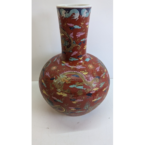 51 - Large Vintage Chinese-Style Polychrome Dragon Vase

A substantial decorative vase of globular form w... 
