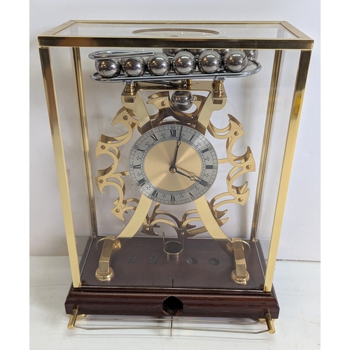 24 - Vintage Comitti of London Congreve-Style Rolling Ball Clock in Glazed Display Case

A vintage Comitt... 