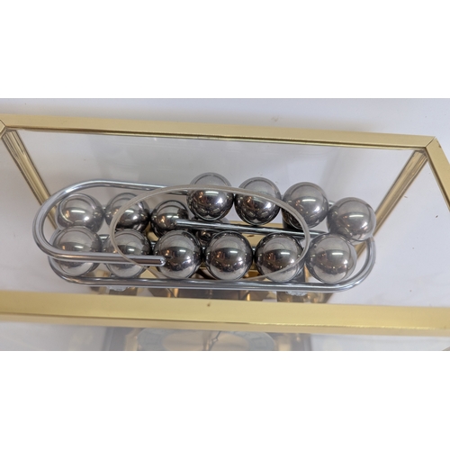24 - Vintage Comitti of London Congreve-Style Rolling Ball Clock in Glazed Display Case

A vintage Comitt... 