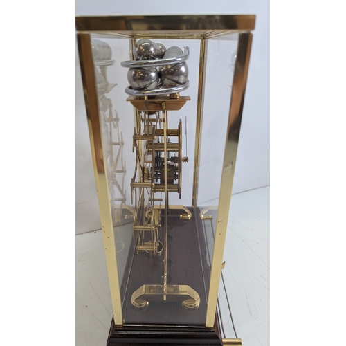 24 - Vintage Comitti of London Congreve-Style Rolling Ball Clock in Glazed Display Case

A vintage Comitt... 