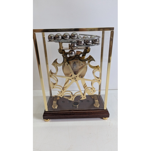 24 - Vintage Comitti of London Congreve-Style Rolling Ball Clock in Glazed Display Case

A vintage Comitt... 
