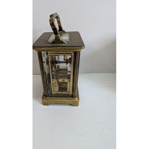 28 - Antique French Brass Four-Glass Carriage Clock with Original Travelling Case

White enamel dial with... 