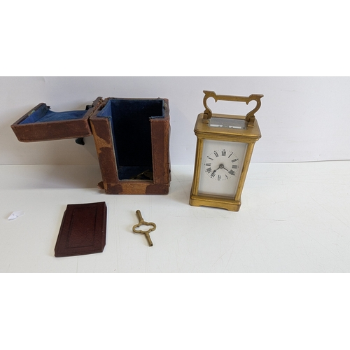 29 - Antique French Brass Four-Glass Carriage Clock with Travelling Case & Key

White enamel dial with Ro... 