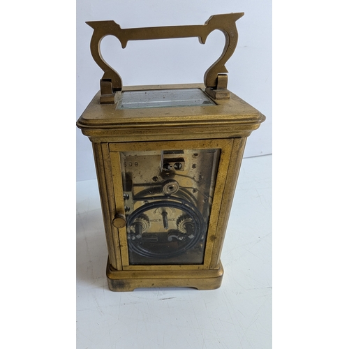 29 - Antique French Brass Four-Glass Carriage Clock with Travelling Case & Key

White enamel dial with Ro... 