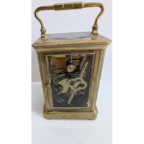 30 - Antique Brass Four-Glass Carriage Clock with Key

White enamel dial with Roman numerals and black ha... 
