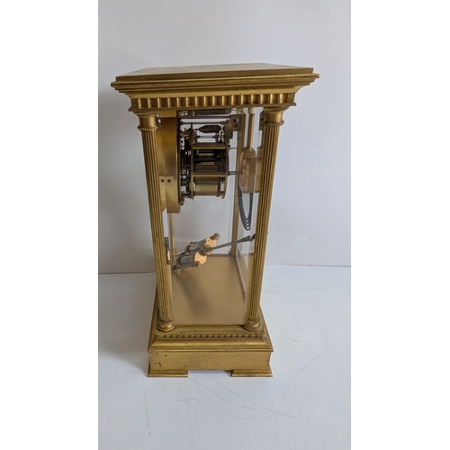 32 - Antique French Four-Glass Striking Mantel Clock with Mercury Pendulum

Architectural gilt-brass case... 