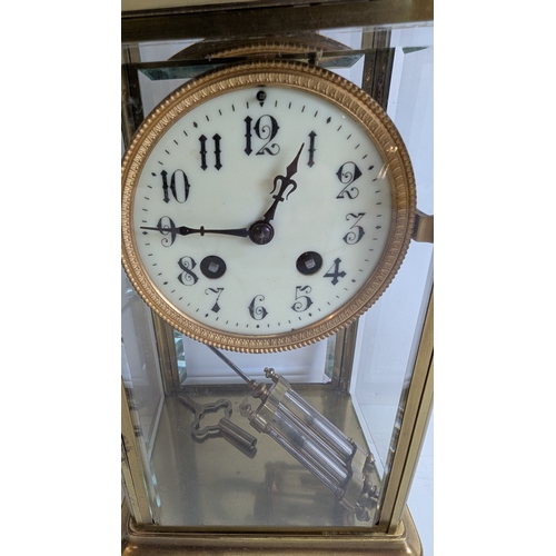 33 - Antique French Four-Glass Striking Mantel Clock with Mercury Pendulum

White enamel dial with decora... 