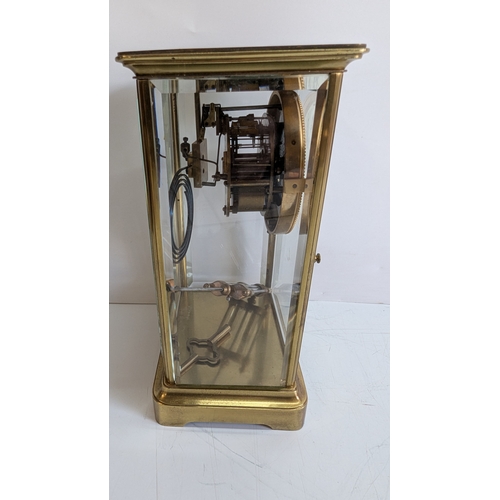 33 - Antique French Four-Glass Striking Mantel Clock with Mercury Pendulum

White enamel dial with decora... 
