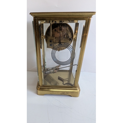 33 - Antique French Four-Glass Striking Mantel Clock with Mercury Pendulum

White enamel dial with decora... 