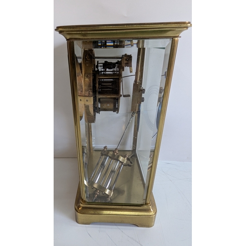 33 - Antique French Four-Glass Striking Mantel Clock with Mercury Pendulum

White enamel dial with decora... 