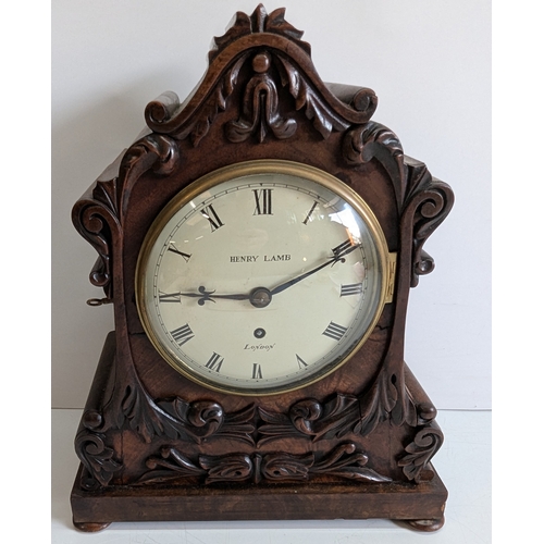 35 - Antique Henry Lamb London Carved Mahogany Mantel Clock

Cream dial signed Henry Lamb, London, with R... 