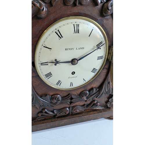 35 - Antique Henry Lamb London Carved Mahogany Mantel Clock

Cream dial signed Henry Lamb, London, with R... 