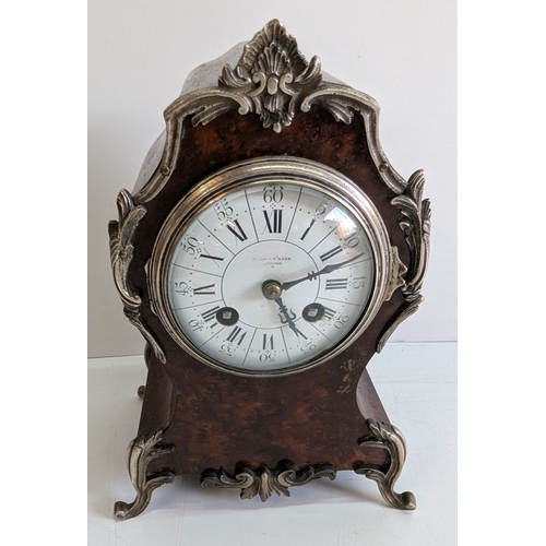 36 - Antique Mappin & Webb London Burr Walnut & Silvered Metal Mounted Mantel Clock

Silvered dial signed... 