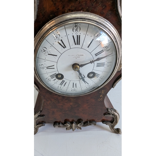 36 - Antique Mappin & Webb London Burr Walnut & Silvered Metal Mounted Mantel Clock

Silvered dial signed... 