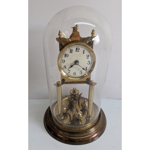 37 - Antique Brass Four-Glass Anniversary Torsion Clock Under Glass Dome

Porcelain dial with Arabic nume... 