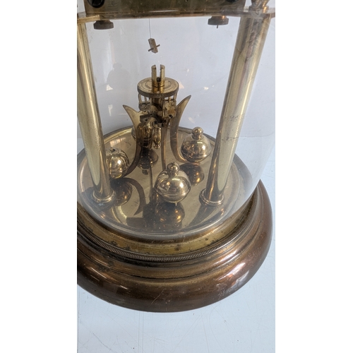 37 - Antique Brass Four-Glass Anniversary Torsion Clock Under Glass Dome

Porcelain dial with Arabic nume... 