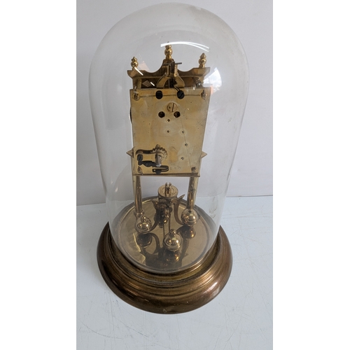 37 - Antique Brass Four-Glass Anniversary Torsion Clock Under Glass Dome

Porcelain dial with Arabic nume... 