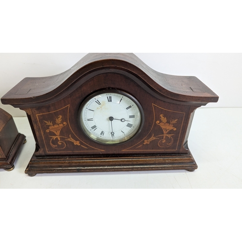 40 - Two Antique Inlaid Mahogany Mantel Clocks

Both with shaped architectural cases, decorative boxwood ... 