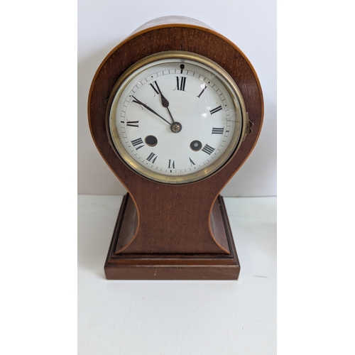 41 - Two Antique Mahogany Balloon Mantel Clocks

The larger example has a white enamel Roman numeral dial... 