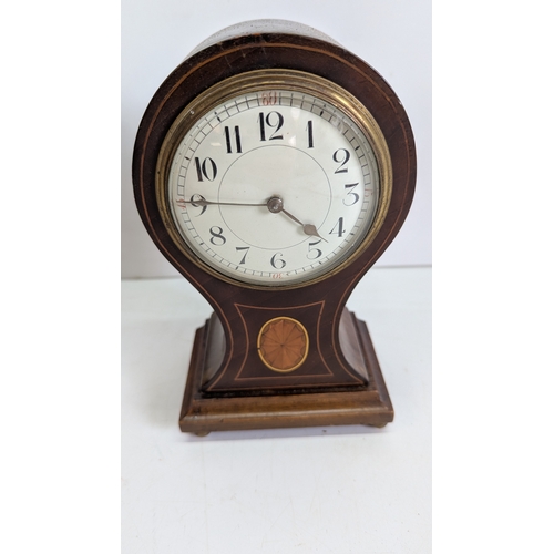 41 - Two Antique Mahogany Balloon Mantel Clocks

The larger example has a white enamel Roman numeral dial... 
