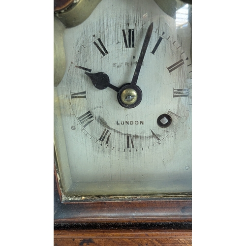 42 - Antique Carved Walnut Bracket Clock

Ornately carved case with prominent floral and foliate decorati... 